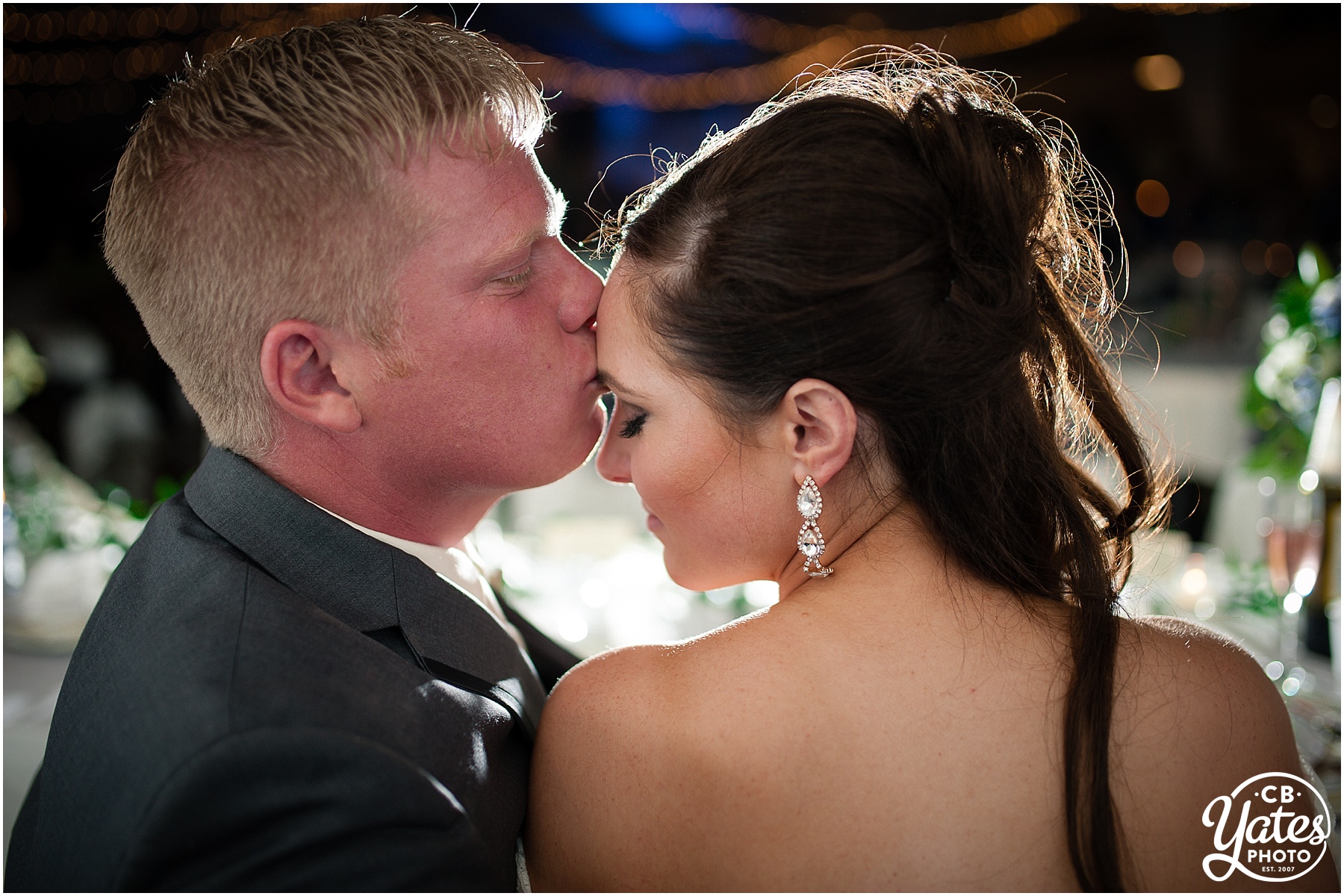 Groom forehead kiss bride photography cb Yates